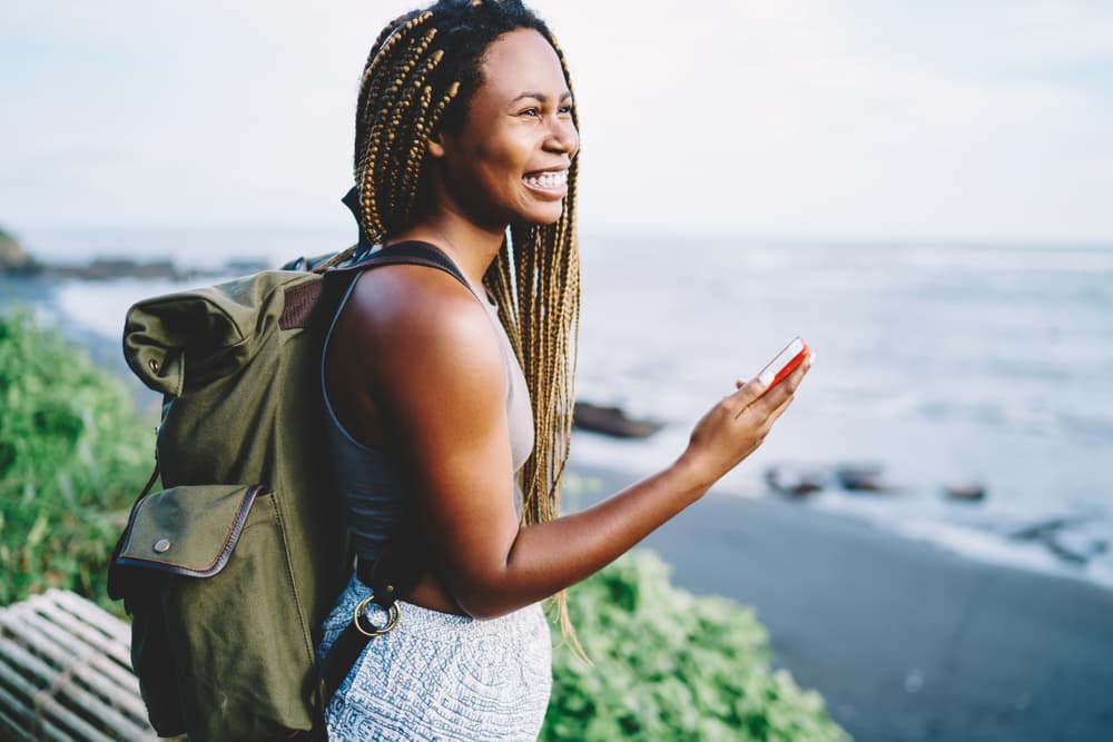 Destinely widget expanded on a laptop confirmation page showing bookable local experiences