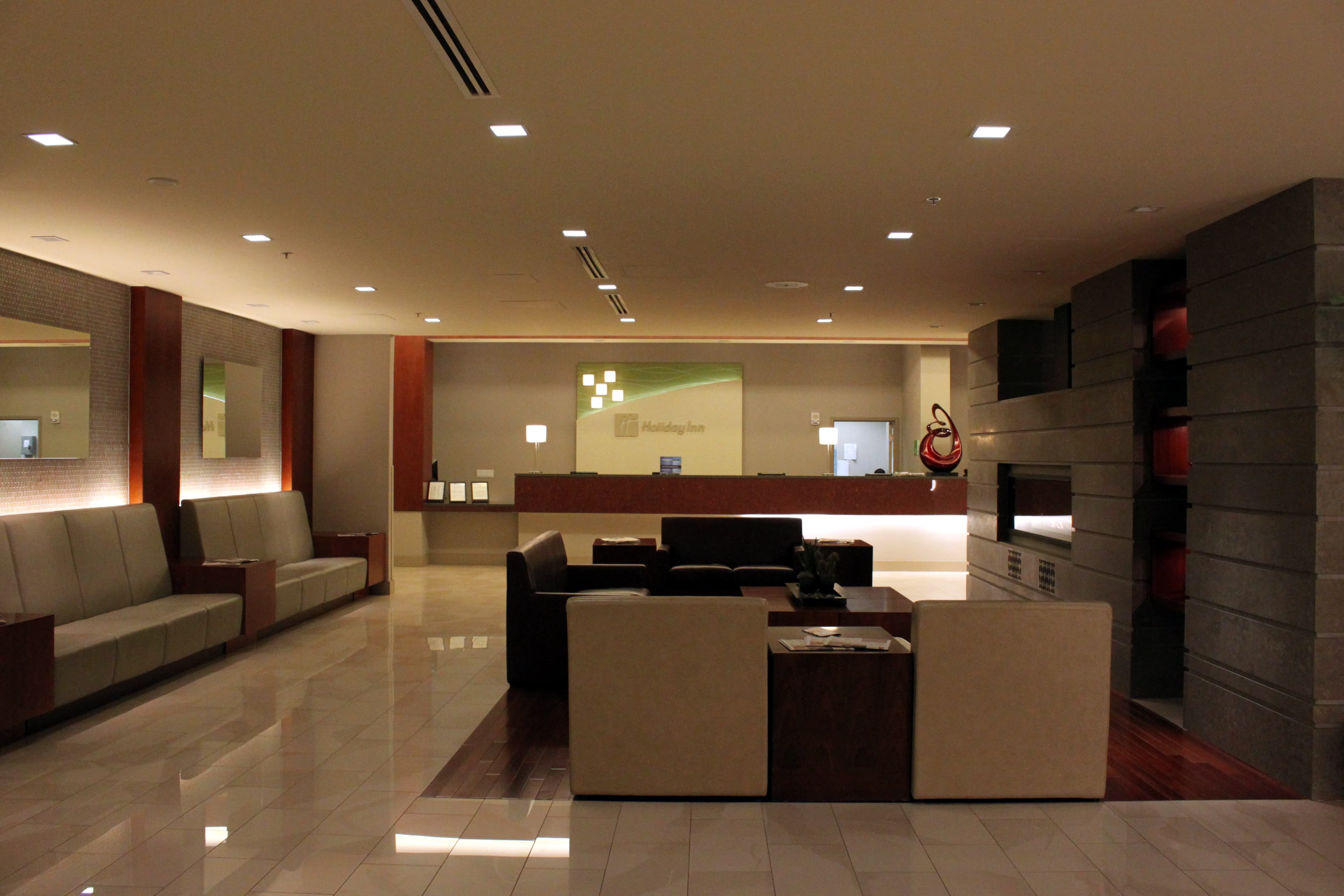 Hotel front desk team assisting guests